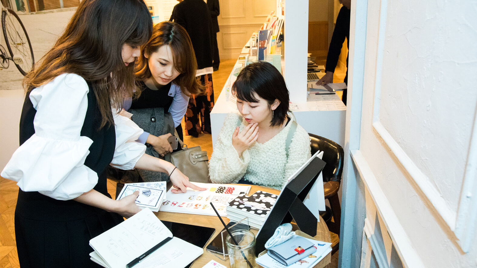 Visitors enjoyed customization on the covers of their notebooks using a UV printer.