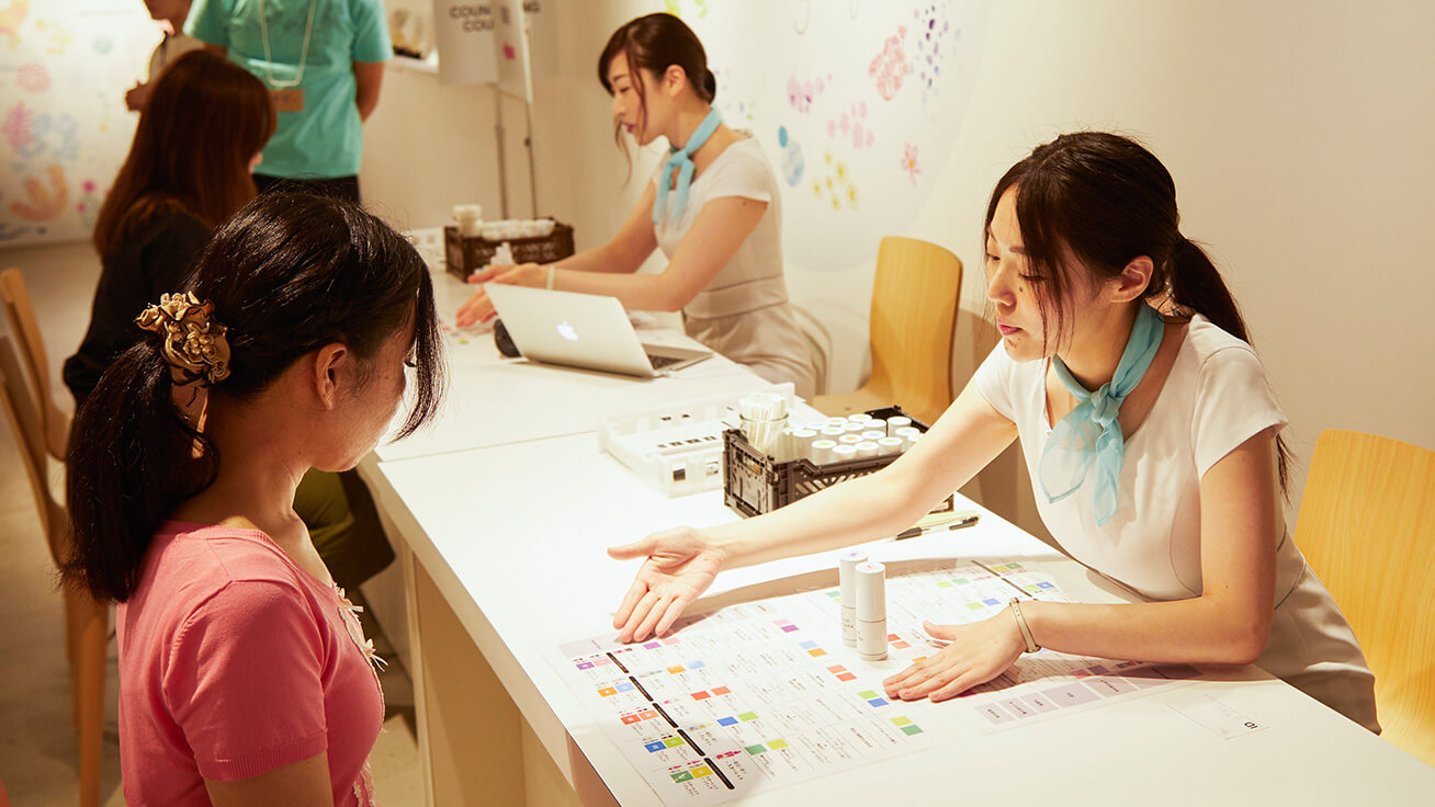 Visitors receiving advice on fragrances