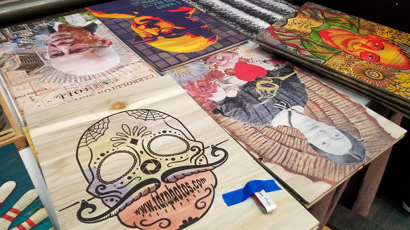 Dia De Los Muertos designs on wood from the pre-show workshop — all printed with VersaUV flatbed technology.