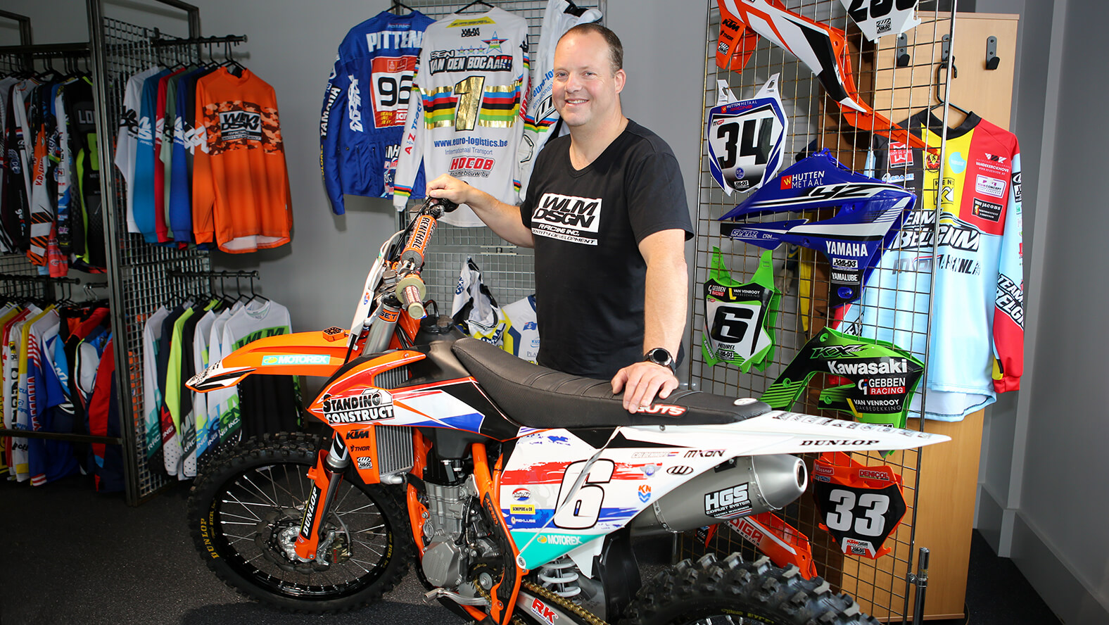 Wisja Lamers, founder of motocross graphics expert WLM Design, posed in their showroom.