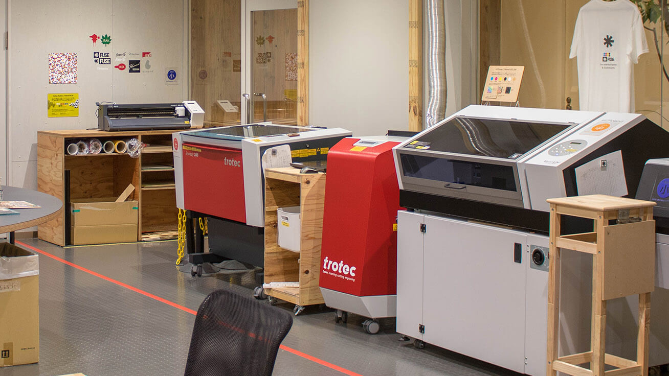 The LEF2-200 UV printer and GS-24 vinyl cutter are set up in the fabrication studio.