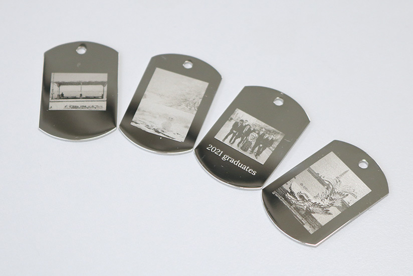 Metallic dog tags made by the interns.