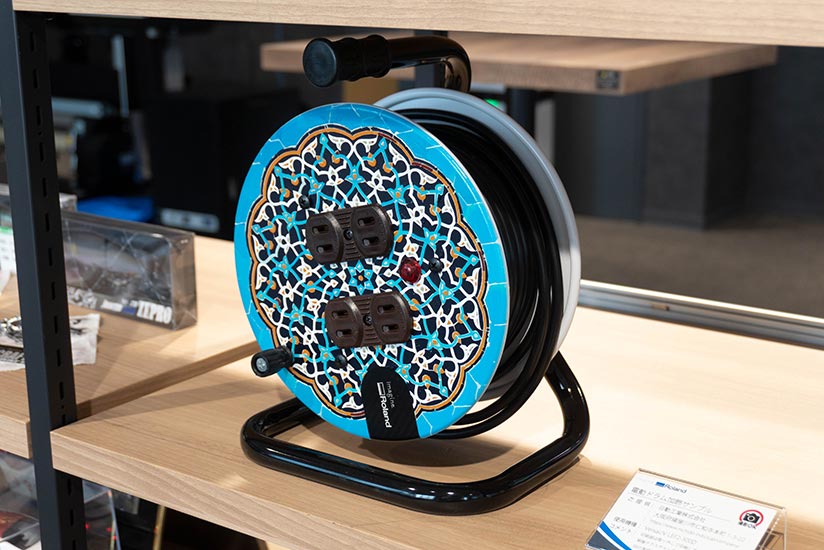 Cable reel made by Nichido Ind. Co., Ltd. customized with a colorful design using the LEF2-300D UV printer.