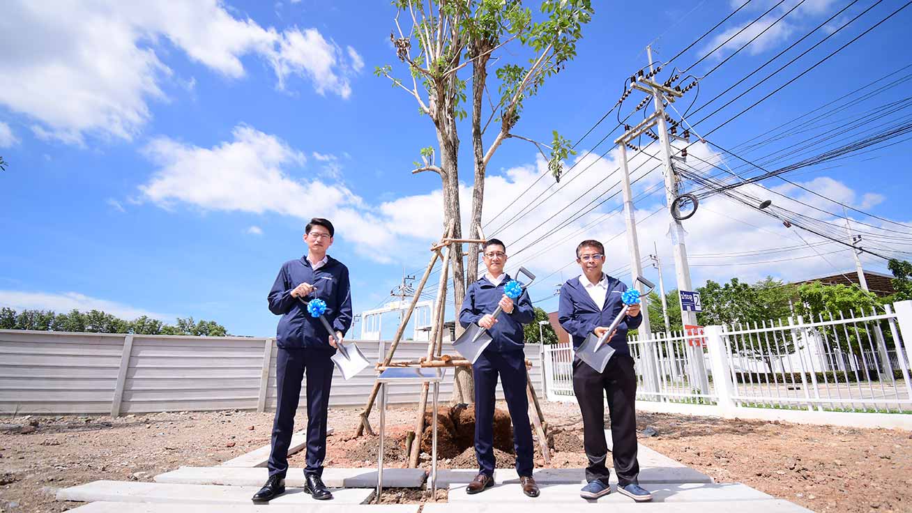 A tree-planting ceremony was held under clear blue skies.