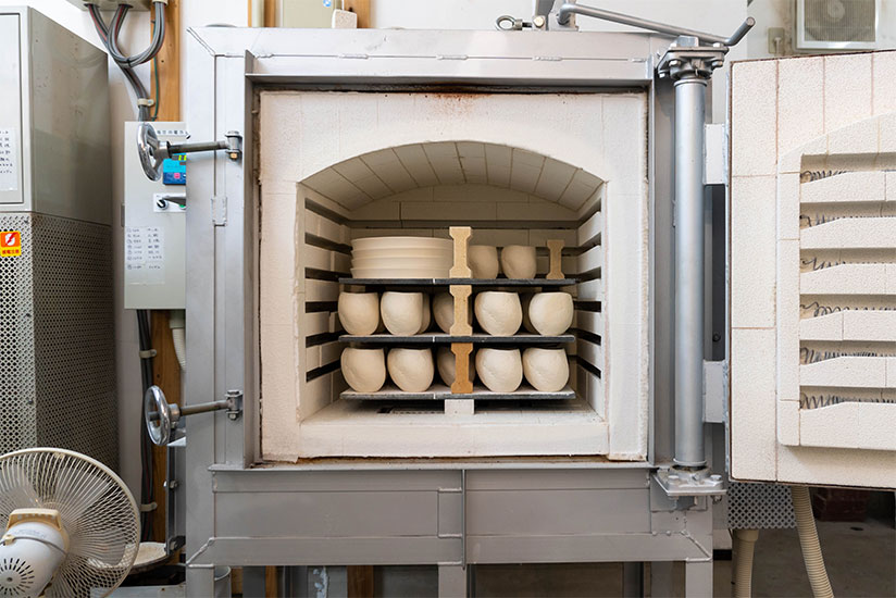 This electrical kiln contains items before being bisque fired.