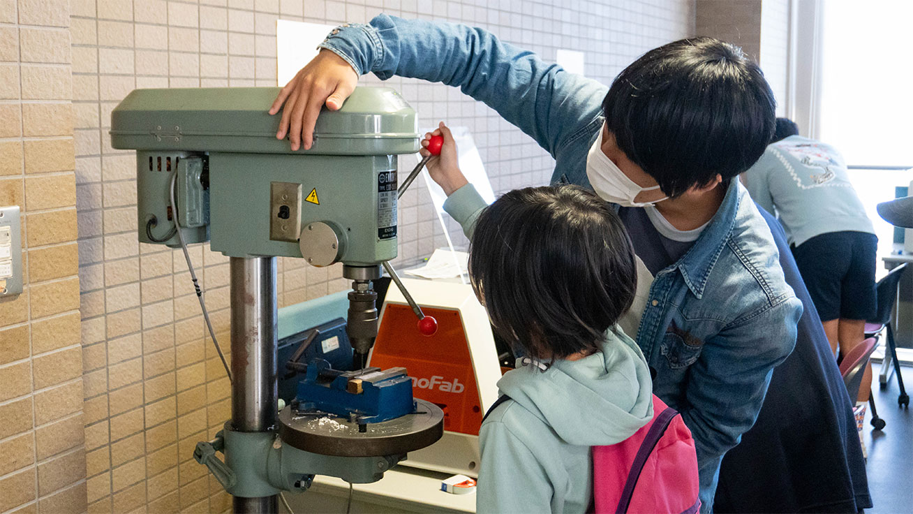 Research lab students helped drill holes in the acrylic to complete the key holders.