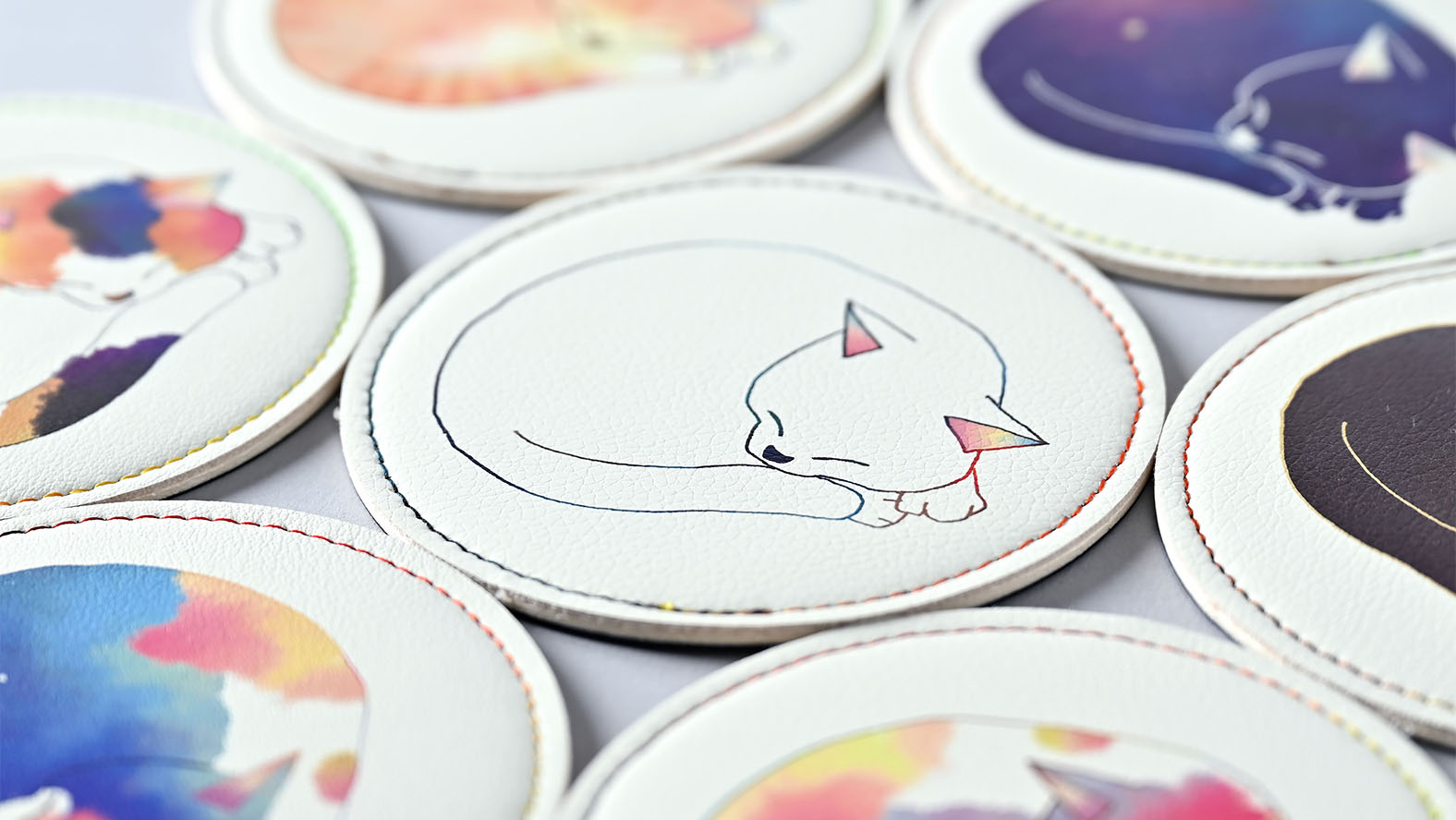 Sobagni coaster featuring a UV printed illustration of a cat