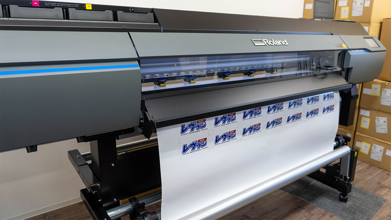 The SG3-540 inkjet printer in use at the Blue Revs merchandising studio.