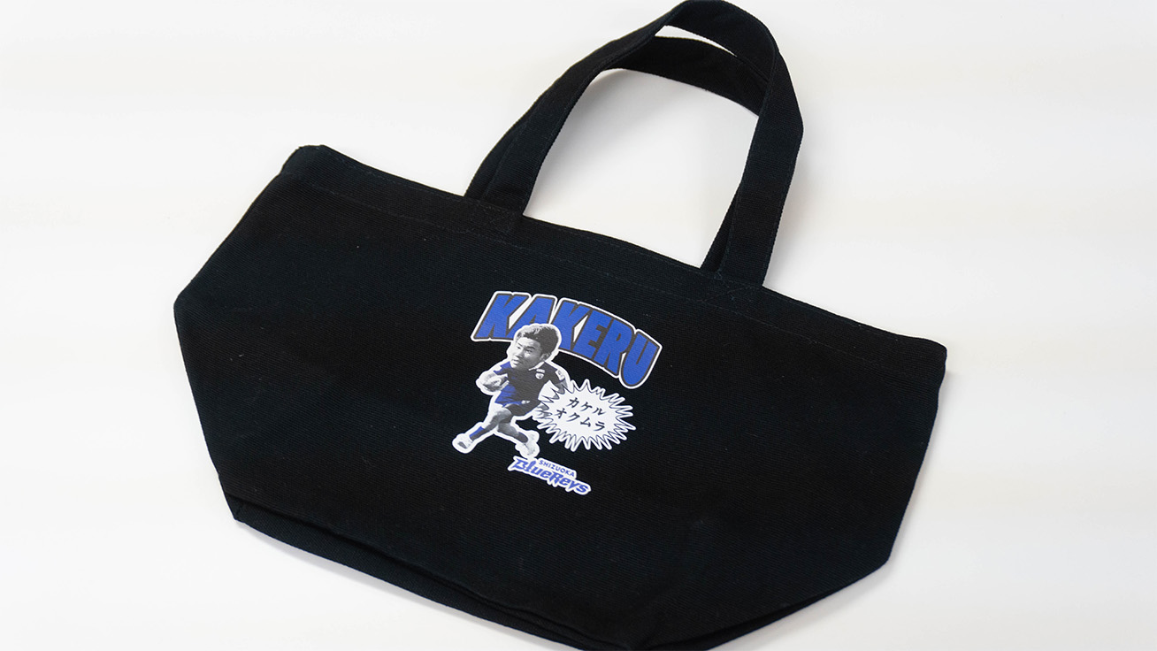 Unique tote bag using a comical design to feature a player.