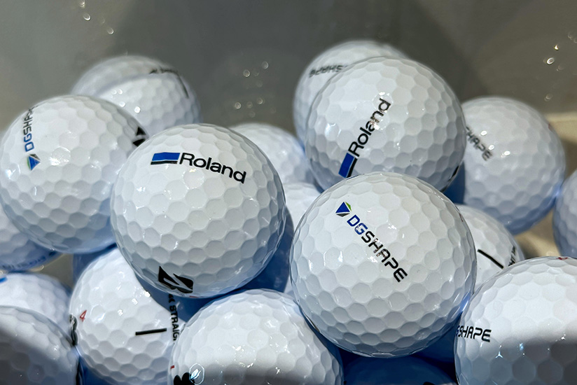 Golf balls with printed logos