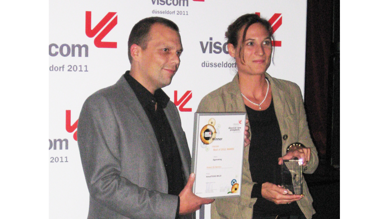 At the award ceremony: (from left to right) Michel Van Vliet, Product Development Manager - Germany of Roland DG Benelux N.V. and Kathrin Schwarz, Sales Manager - Roland DG Deutschland GmbH