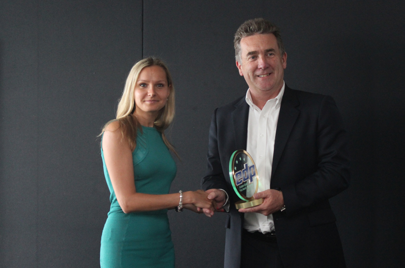 Jerry Davies CEO of Roland DG (UK) receives the award on behalf of Roland DG group